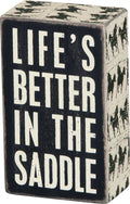 In The Saddle Box Sign