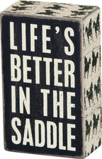 In The Saddle Box Sign