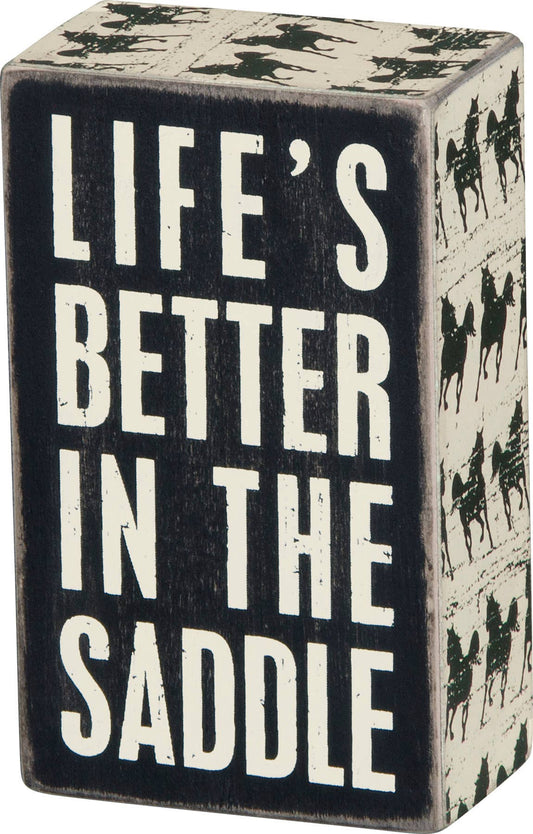 In The Saddle Box Sign