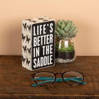 In The Saddle Box Sign